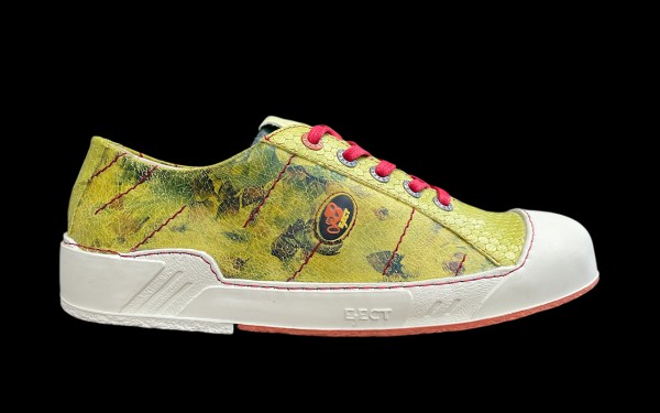 Seitenansicht: Gelber Sneaker EJECT Puzzle mit roter Schnürung